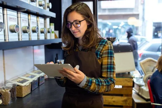 a girl checking coffee shops inventory